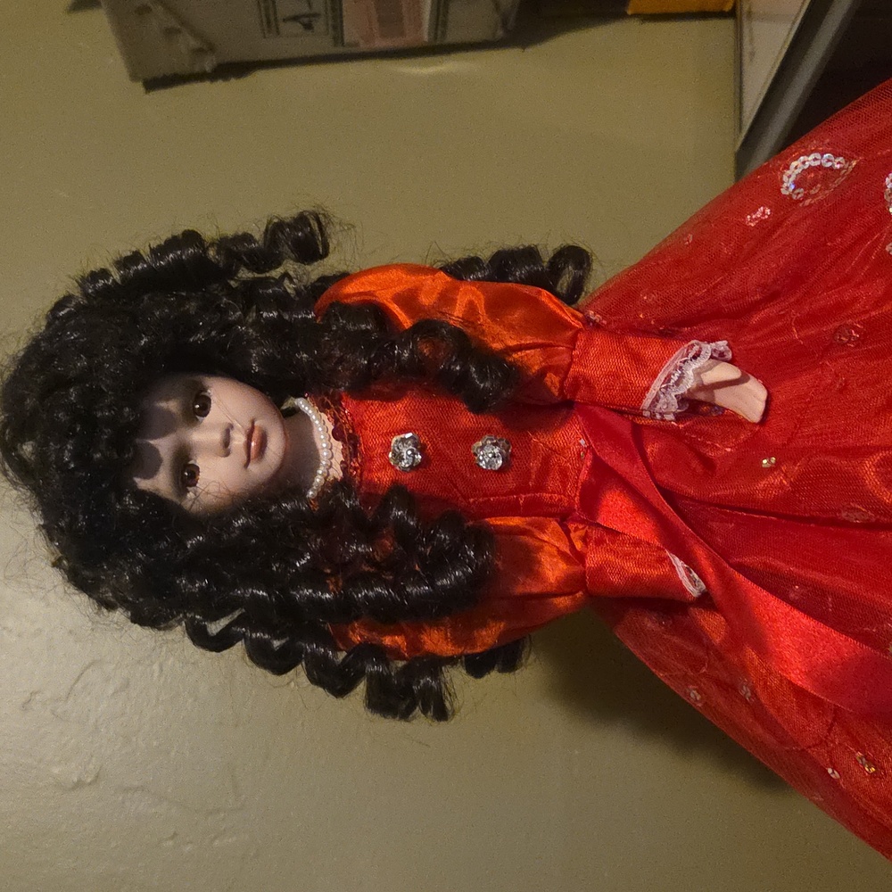 Charming Orange and Black Doll with Curly Hair - Picture 3 of 9